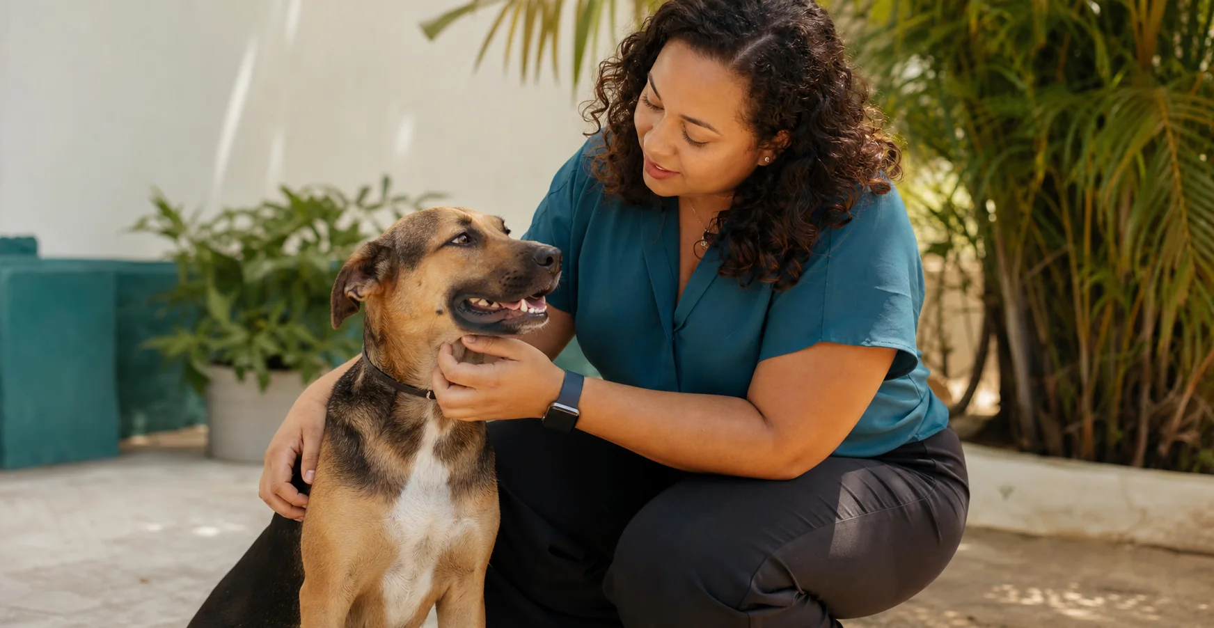Community volunteer caring for a rescued dog